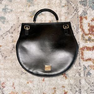 NWOT black Kooba circular bag.
